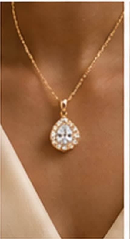 Gold diamond necklace on draped fabric