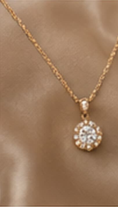 A delicate round diamond pendant