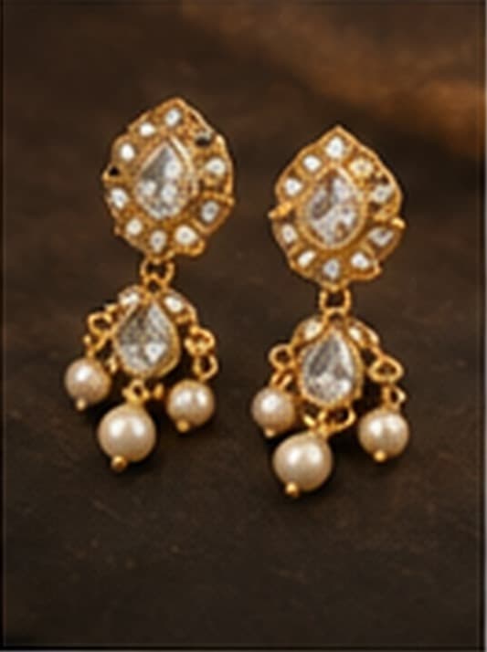 Polki earrings with pearl drops on a deep ground
