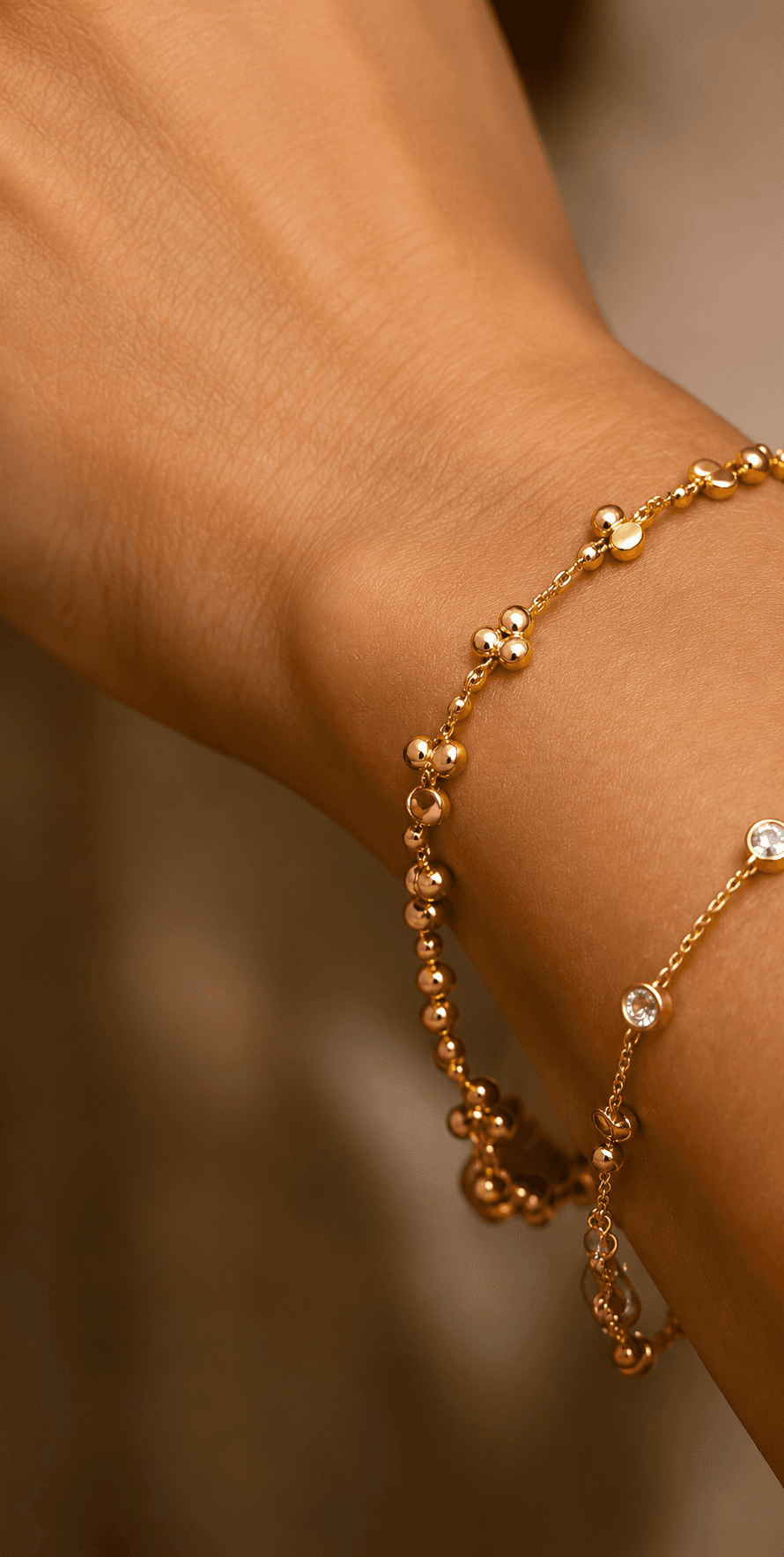 Beaded gold bracelet worn on the wrist
