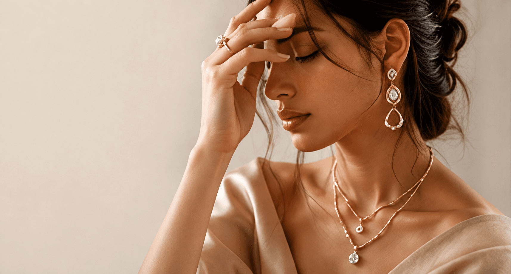 Model wearing IPSA JEWELS gold and diamond earrings with layered necklaces